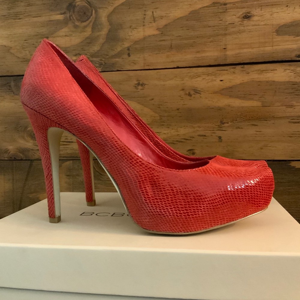 BCBGeneration cherry snake leather platform pumps.